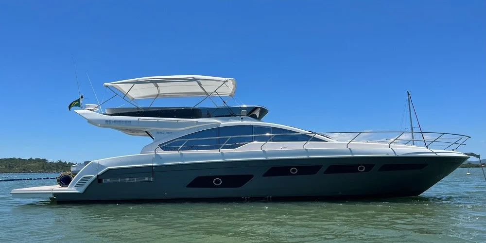 Luxury yacht with sleek design floating on calm water in Miami.