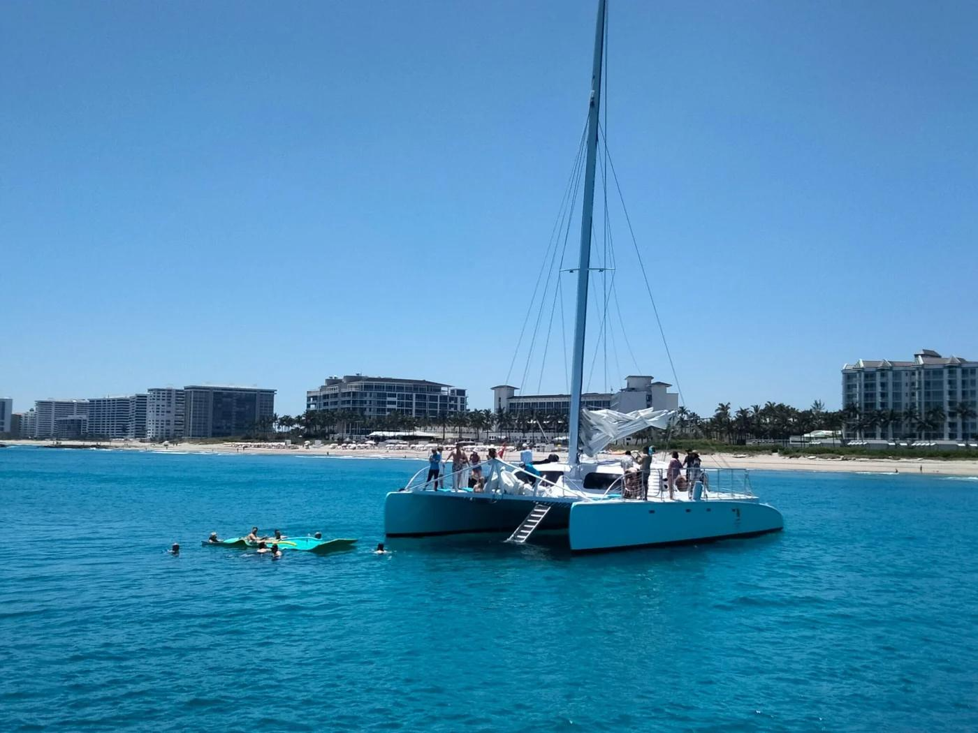 A large group of family and friends gather on a rental yacht for a day of fun in West Palm Beach.