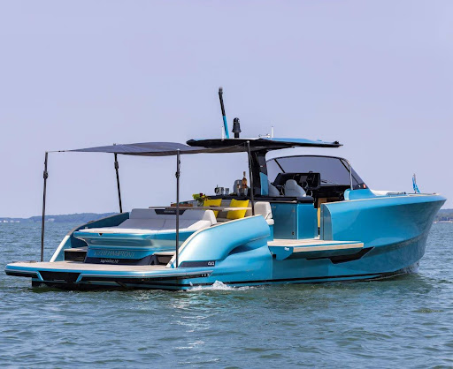 Luxury yacht with a couch, sun cover, and space to sleep.