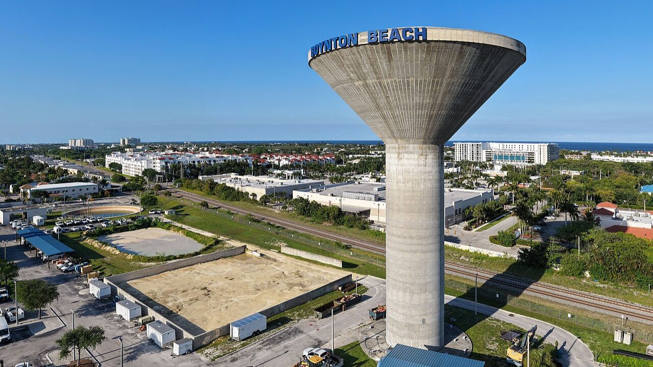 Boynton Beach water tower overlooking coastal cityscape and ocean. 