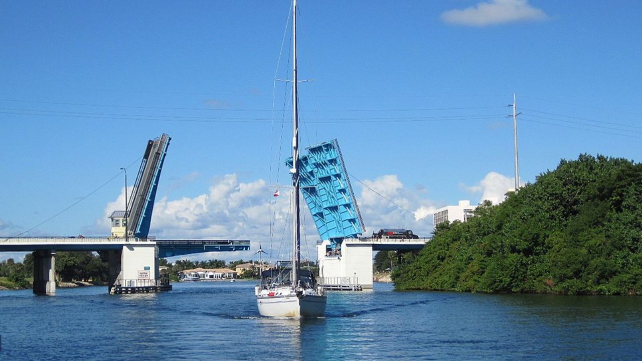  North Palm Beach drawbridge raised for sailboat passage below. 